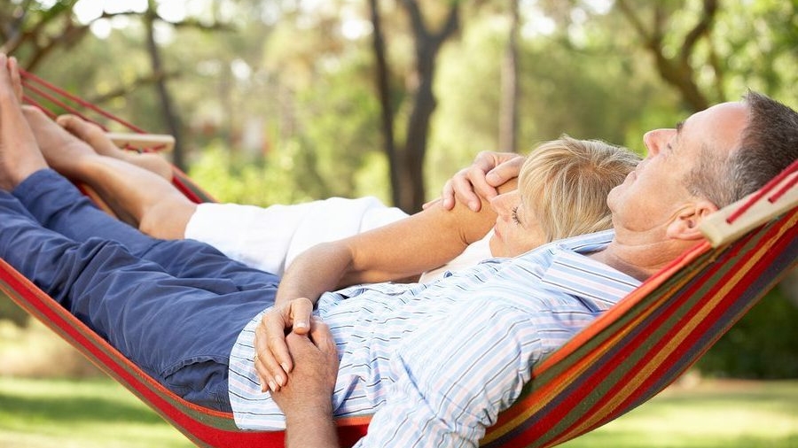 Senior Couple Relaxing In Hammock