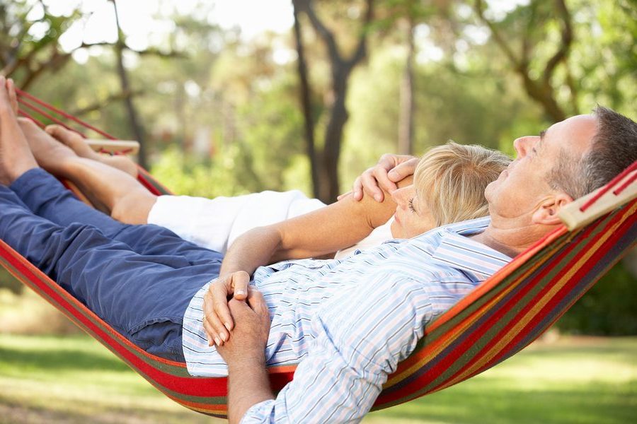 Senior Couple Relaxing In Hammock